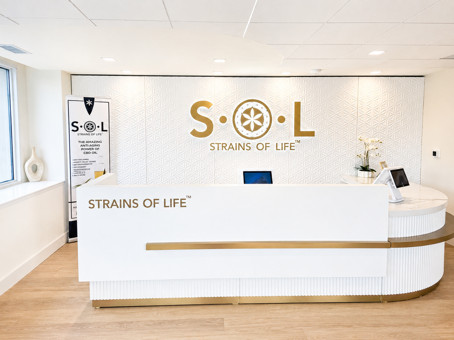 SOL OF POTOMAC DISPENSARY PENTHOUSE 1 SOL of Potomac Dispensary Penthouse reception desk with S·O·L Strains of Life logo wall