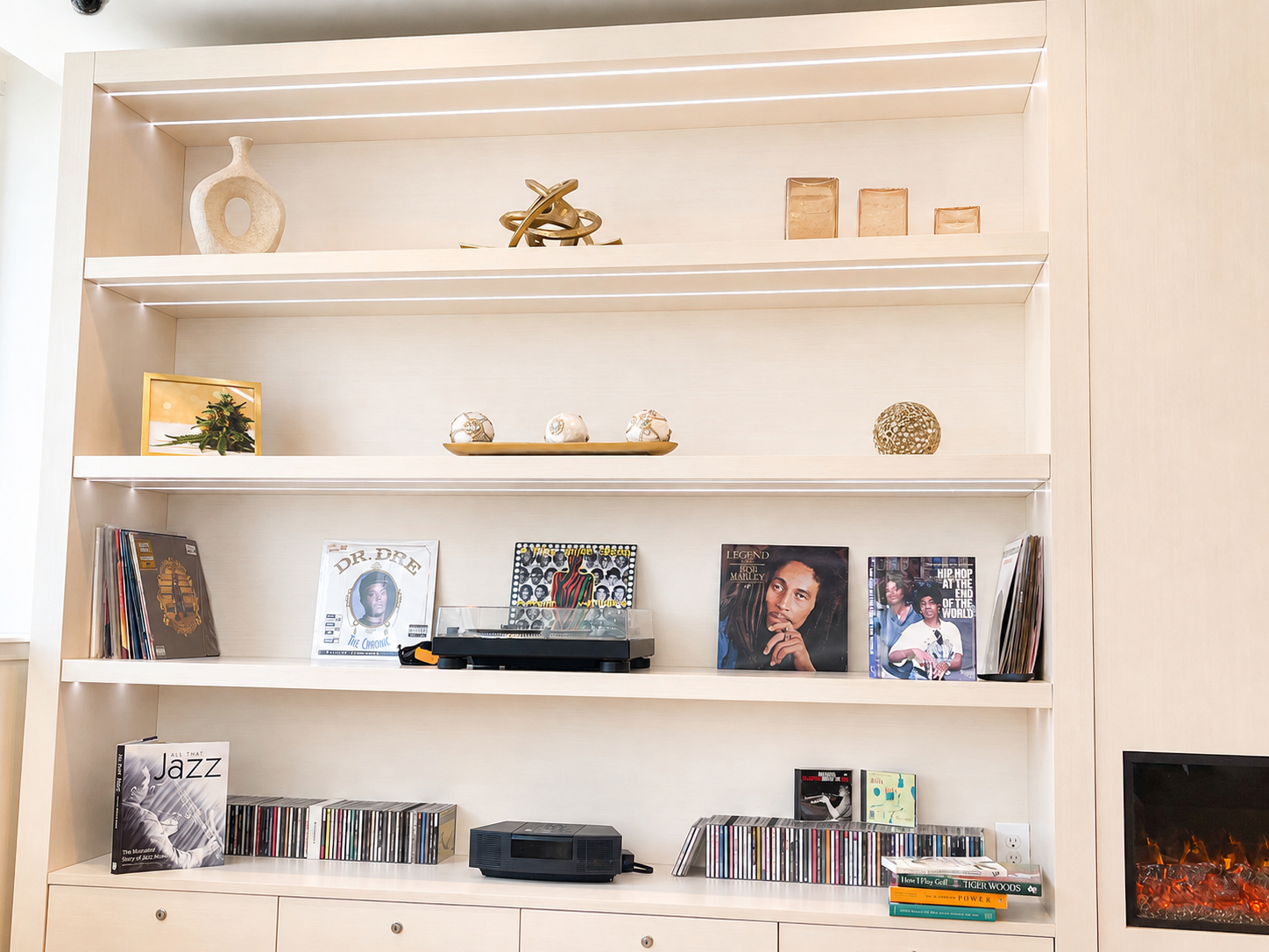 SOL OF POTOMAC DISPENSARY PENTHOUSE 4 SOL of Potomac Dispensary Penthouse built-in shelving with vinyl records and fireplace lounge